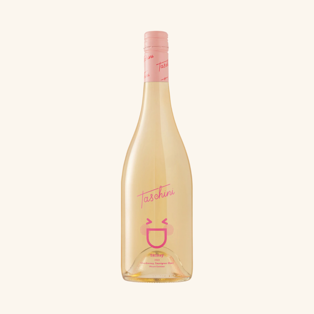 A bottle of Taschini Skinsy wine with a pink label and cap, displaying the variety and name of the wine.