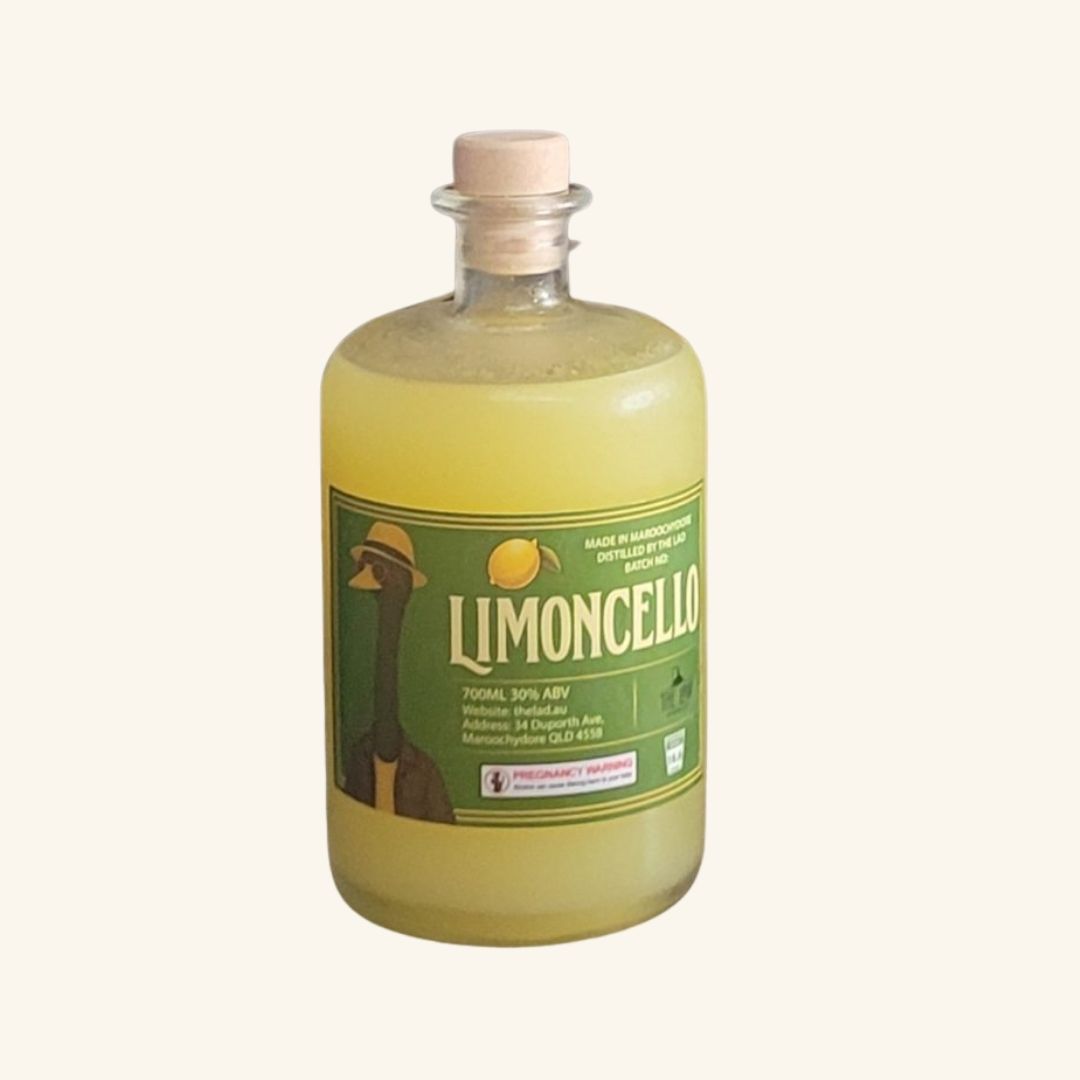 Bottle of limoncello with a green label on a white background