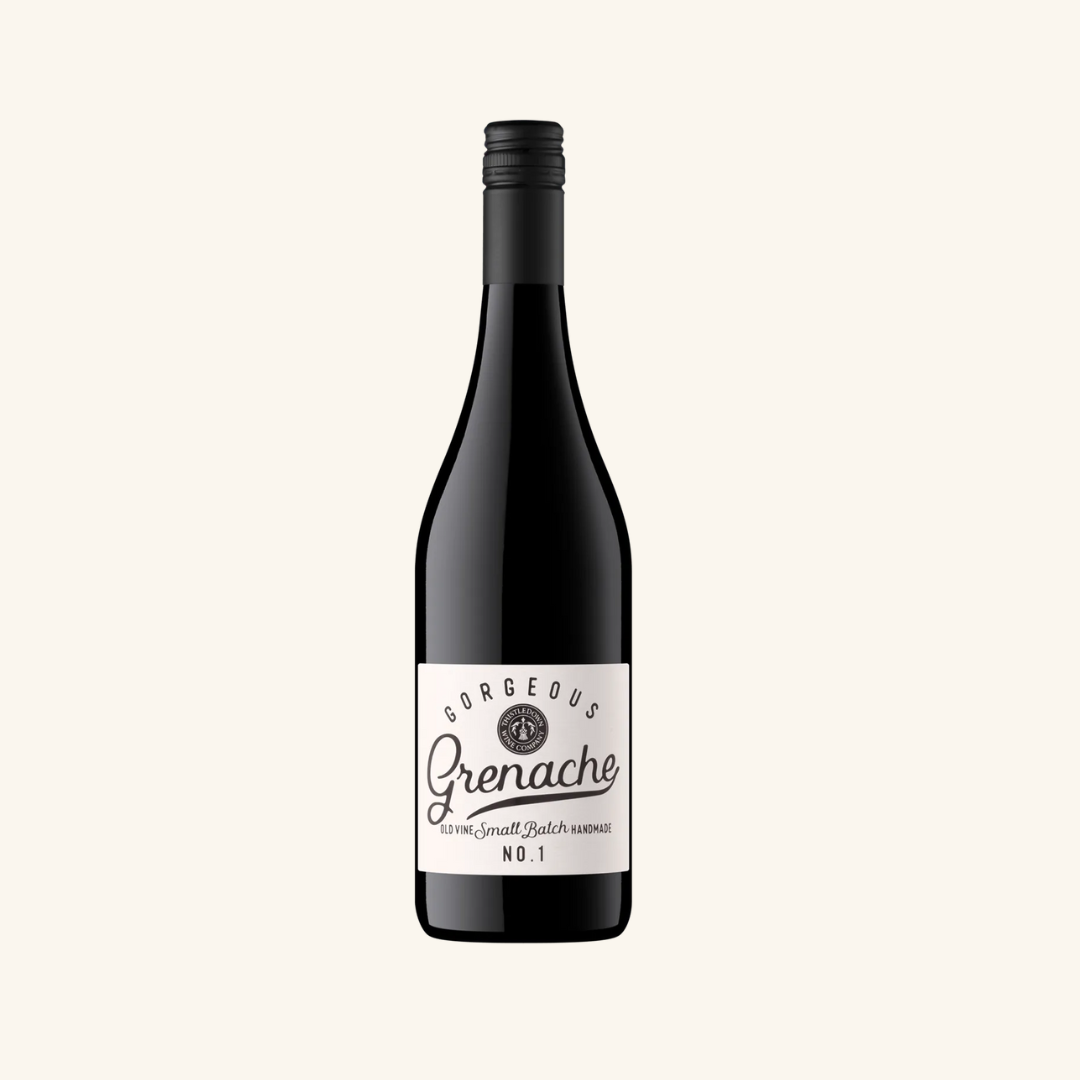 Bottle of Thistledown Gorgeous Grenache wine with a black label featuring the product name and variety in white and orange text.