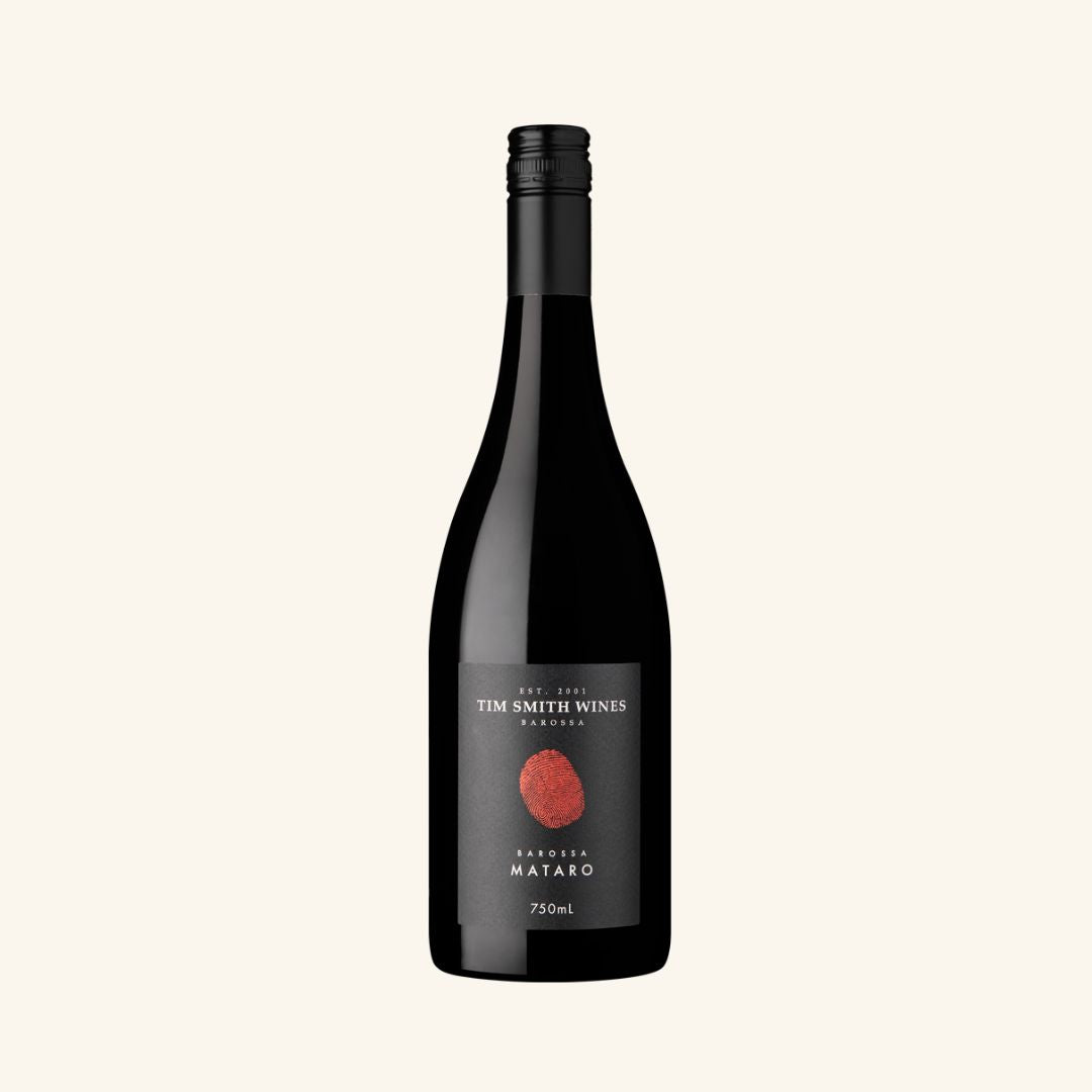 Bottle of Tim Smith Wines Barossa Mataro wine with a dark label and a red wine visible through the transparent bottle.