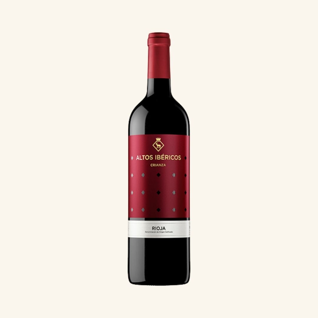 Red wine bottle with a visible label branded altos ibericos rioja torres on a white background