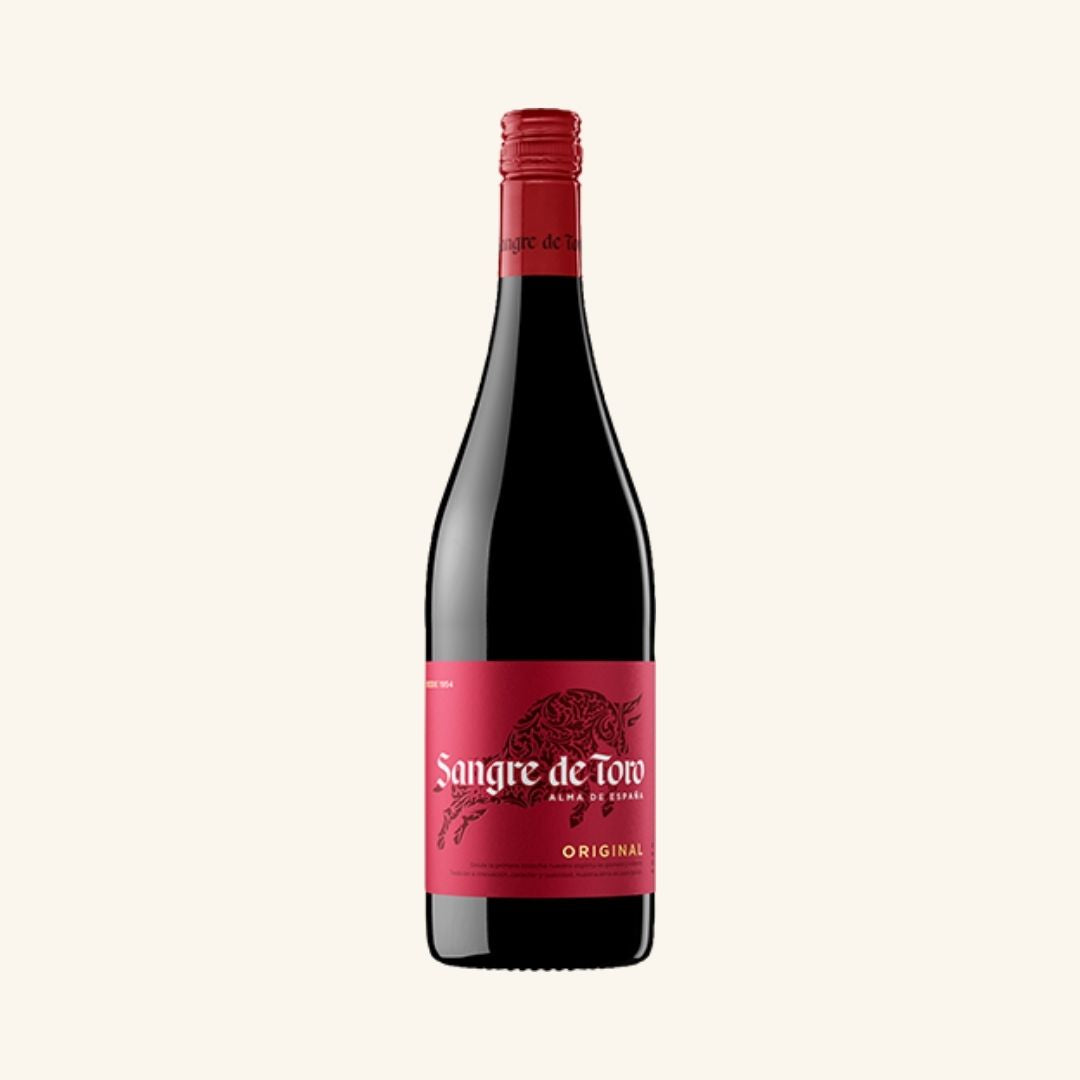 Red wine bottle with a red label branded sangre de toto original on a white background