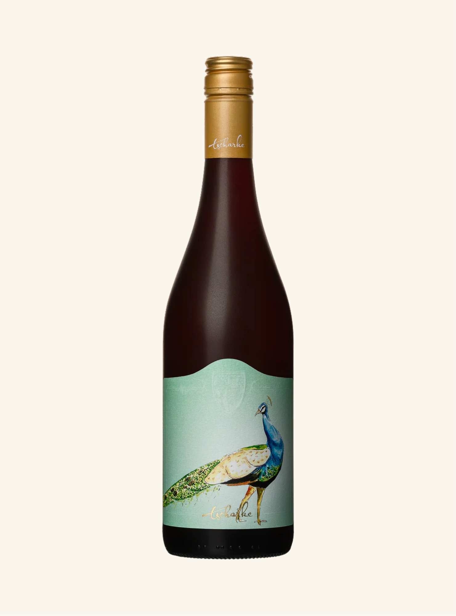 Wine bottle with peacock design on label against a white background