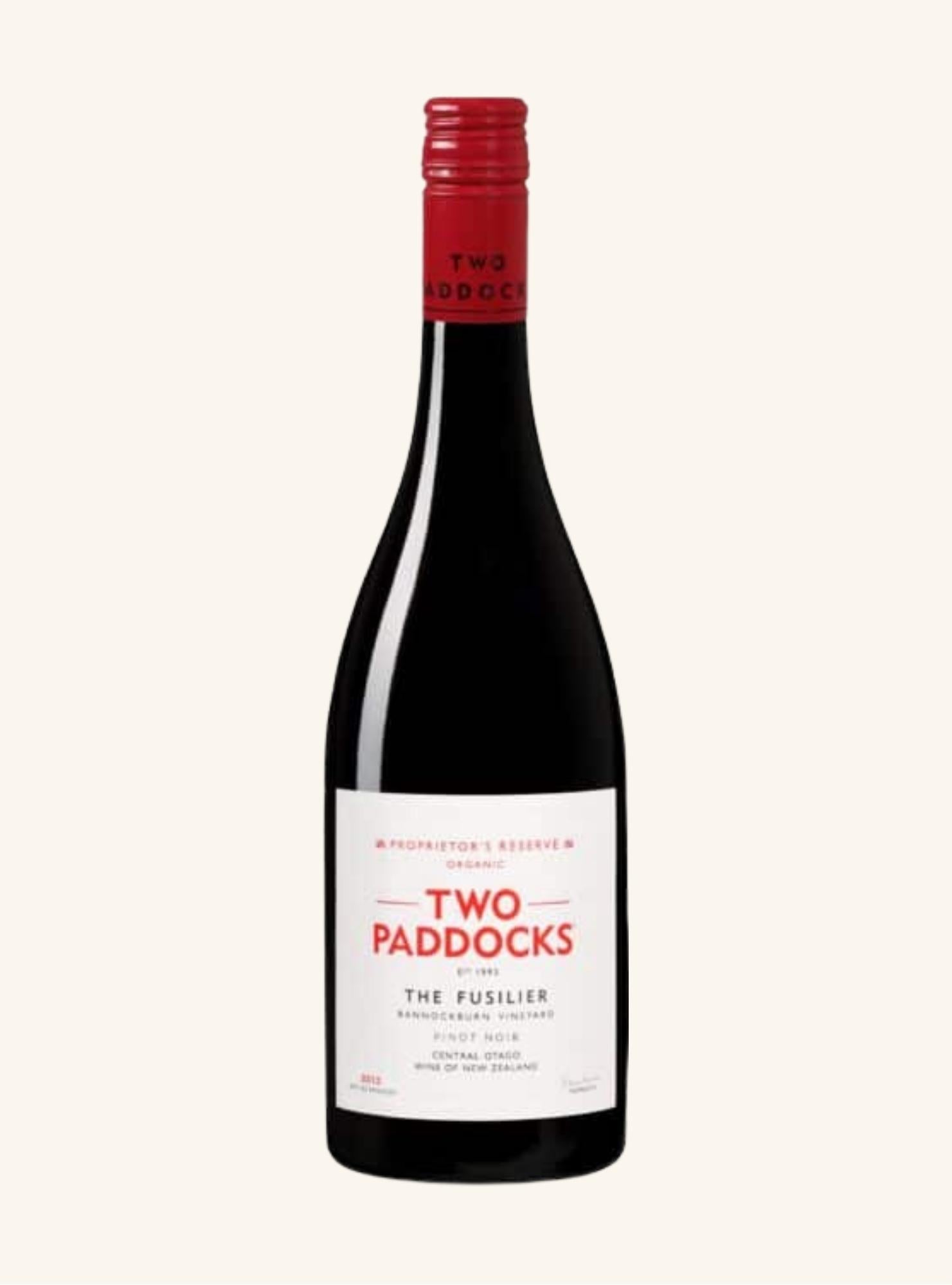 Wine bottle with 'Two Paddocks the fusilier pinot noir' label on a white background