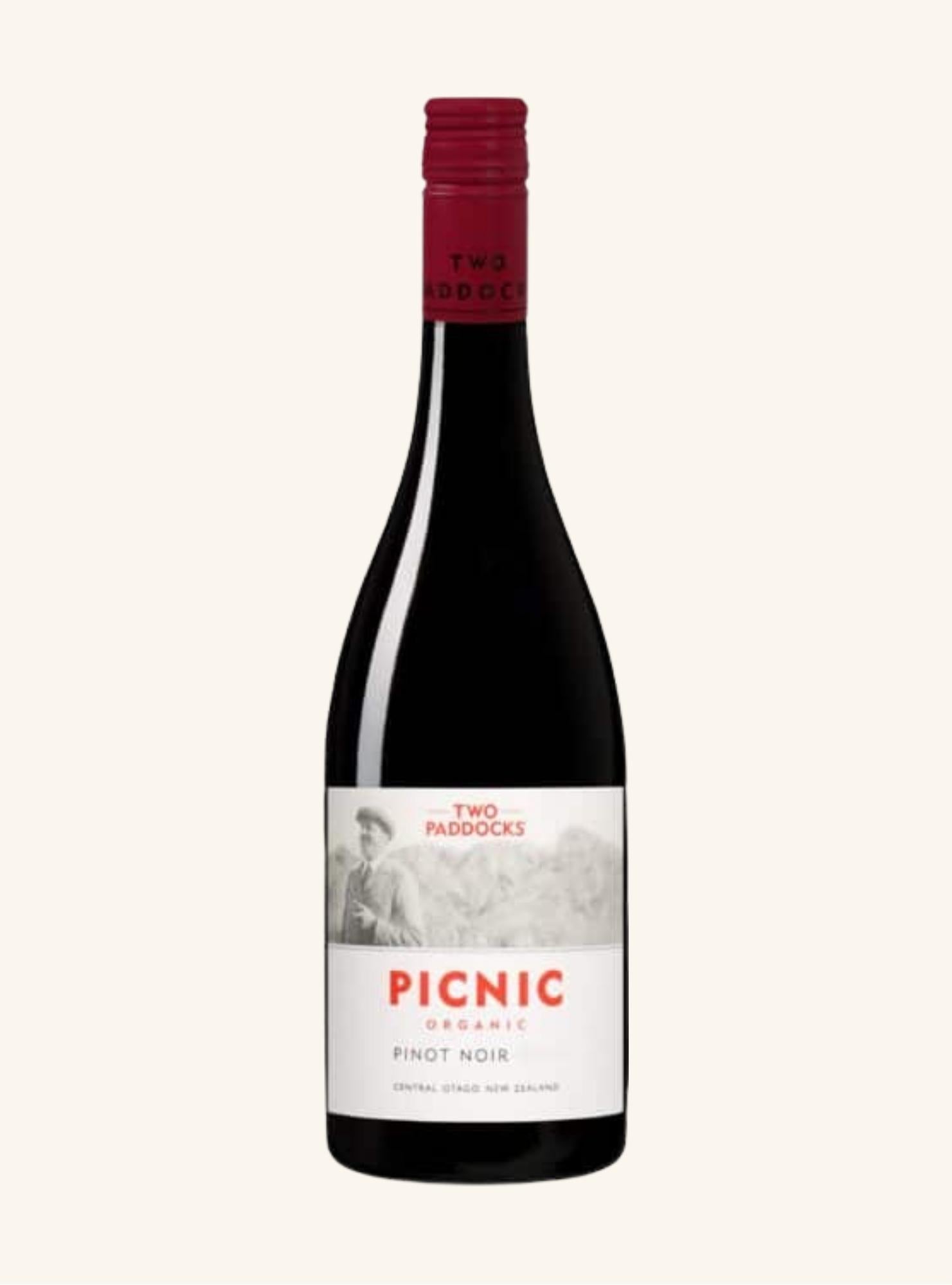 Wine bottle with 'Two Paddocks Picnic organic pinot noir' label on a white background