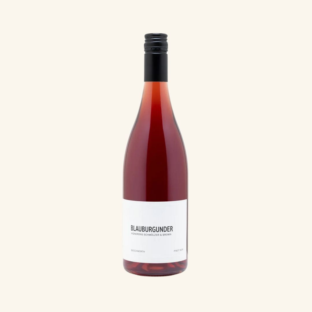 Red wine bottle with a white label on a white background