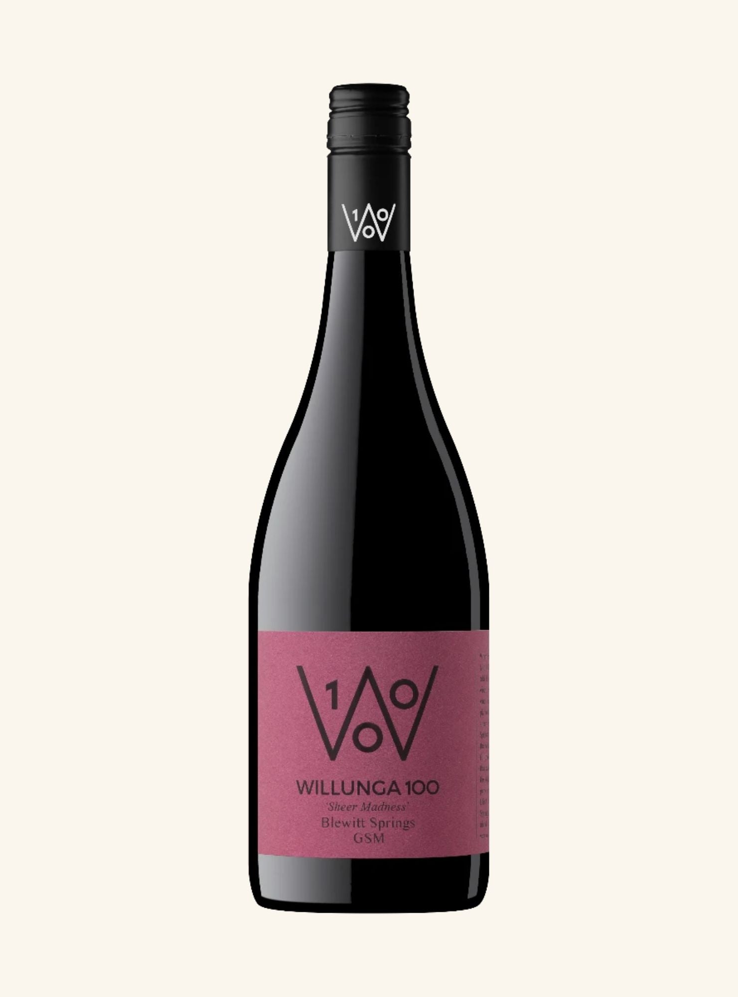 A bottle of Willunga 100 Shiraz Reserve from the brand V&V, featuring a dark glass bottle with a black cap and a dusty pink label, set against a solid off-white background.